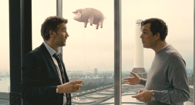 Screenshot from “Children of Men” showing Clive Owen and Danny Huston, with Pink Floyd's flying pig in the background. (dir. Alfonso Cuarón, 2006). Graphic: Universal Studios