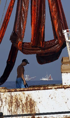 Booms covered with oil hang on the shrimp boat Mariah Jade in Breton Sound on 6 May 2010. Alex Brandon / The Associated Press