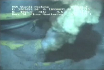 This image from a video released by BP PLC shows oil spewing from a yellowish, broken pipe 5,000 feet below the surface. The oil looks like steam rushing from a geyser. The video released Wednesday May 12, 2010, gives a glimpse of the leaking well a mile underwater. (AP Photo / BP PLC)