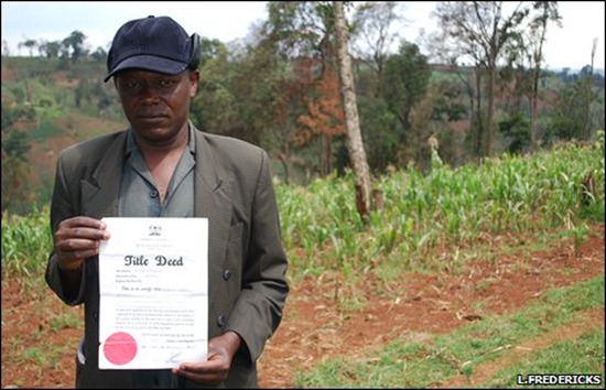 Mau resident shows title deed to his land. BBC / L. Fredericks