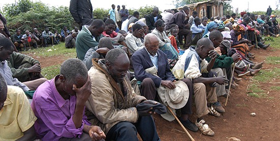 Seeking divine help on the burden that weighs heavily on their shoulders regarding their future, settlers in South Western Mau who are camping on the roadside at Kapkembo in Kuresoi, say a prayer before a meeting on Friday. Photo / JOSEPH KIHERI 