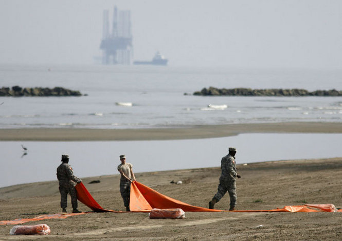 Members of the Louisiana National Guard place boom on the beaches at Grand Isle State Park, Wednesday May 26, 2010. DAVID GRUNFELD / THE TIMES-PICAYUNE