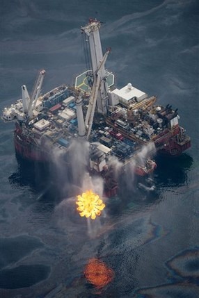 The Q4000 drilling rig operates in the Gulf of Mexico at the site of the Deepwater Horizon disaster Wednesday, June 16, 2010. Oil is still leaking from the wellhead. Oil and natural gas are being flared by an EverGreen burning device. AP Photo / Dave Martin