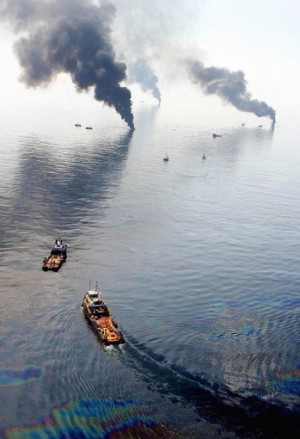 Smoke billows from controlled burns in the Gulf of Mexico, 13 June 2010. Fireproof booms corral the crude but also catch seaweed and the creatures that thrive in it. So-called burn boxes are torching oil from the water's surface at the sacrifice of turtles, crabs, sea slugs and other sea life. Sean Gardner / Reuters