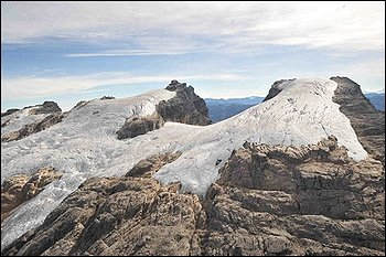 This undated photo released by Papua Project Freeport-McMoRan shows glaciers on Puncak Jaya, mountains in eastern Indonesia. 'These glaciers are dying,' Lonnie Thompson, one of the world's most accomplished glaciologists, said Wednesday, June 30, 2010, after wrapping up a 13-day trip to Puncak Jaya, rarely visited even by local tribesman. 'Before I was thinking they had a few decades, but now I'd say we're looking at years.' AP Photo / Papua Project Freeport McMoRan