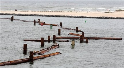 Pieces of a $4 million oil booming system in Perdido Pass in Orange Beach, Alabama, came apart when 6-foot seas caused by Hurricane Alex battered the pass Thursday, 1 July 2010. Dave Martin, The Times-Picayune