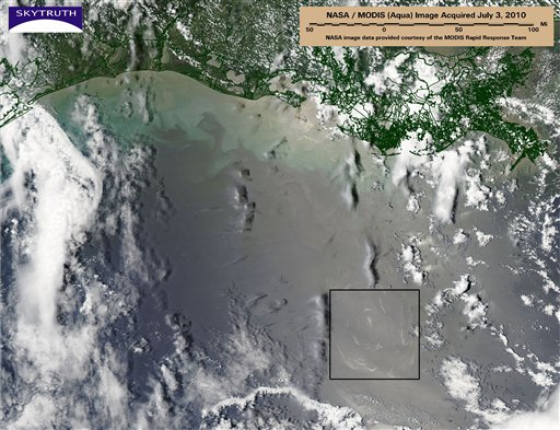 This July 3, 2010 satellite photo released by NASA and processed by SkyTruth, shows a cluster of oil slicks caused by natural oil and gas seeps in the Gulf, highlighted by a detail box, about 120 miles off the Louisiana coast in deep water at the edge of the continental shelf. Neither industry nor government checks for leaks at the more than 27,000 oil and gas wells abandoned in the Gulf of Mexico since the late 1940s. AP Photo / NASA via SkyTruth