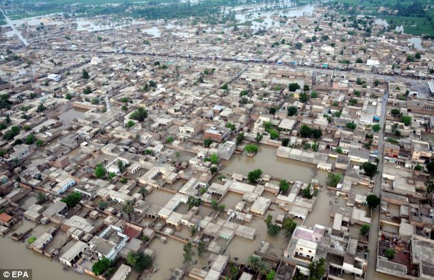 Devastated: Flooded areas in Mehmood Kot, in southern Punjab province, Pakistan. British charities have raised £5 million in just days to help the relief effort. EPA via dailymail.co.uk