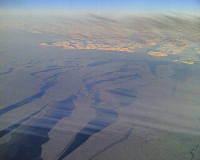 Arctic sea ice, photographed on a flight to Hong Kong over the Bering Strait and the wilderness of Russia, 25 January 2007. Wai Yip Tung / tungwaiyip.info