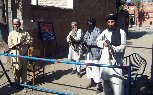 Al Qaeda militants guard a checkpoint in Pakistan. ricks.foreignpolicy.com
