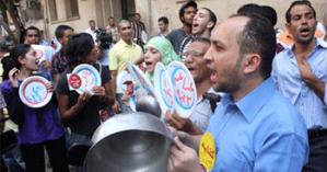 Protesters from seven opposition groups Monday afternoon, 9 August 2010, staged a demonstration outside the Cabinet headquarters in central Cairo against hikes in food prices. They banged empty pots with spoons in protest against recent increases in food prices. Amr Emam / The Egyptian Gazette Online