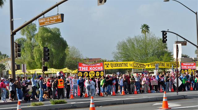 'Quarantine the Kochs': Koch-blockers gather outside the Rancho Las Palmas Hotel to protest the Koch brothers and their massive anti-climate science propaganda campaign, 31 January 2011. Mike Roddy