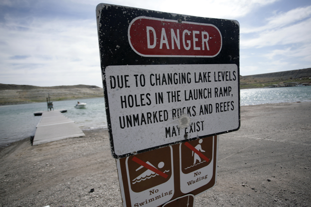 A sign at a launch ramp at Lake Mead warns boaters of hazards created by falling water levels, 15 January 2011. Las Vegas Sun