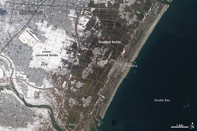 A swath of agricultural fields lies between the Japanese city of Sendai and Sendai Bay, and the area was one of the hardest hit by the tsunami on March 11, 2011. The Advanced Land Imager (ALI) on NASA’s Earth Observing-1 (EO-1) satellite captured this natural-color image of the area on March 18, 2011. One week after the magnitude-9.0 earthquake and resulting tsunami, the fields nearest the ocean were still covered with standing water. NASA Earth Observatory image created by Jesse Allen and Robert Simmon