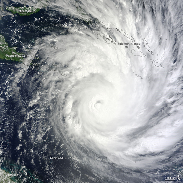 On February 1, 2011, Cyclone Yasi continued on its path toward Queensland, Australia. The Moderate Resolution Imaging Spectroradiometer (MODIS) on NASA’s Terra satellite captured this natural-color image at 10:00 a.m. Queensland time (00:00 Universal Time) on February 1. The storm extends over the Solomon Islands and grazes Papua New Guinea. Part of the Queensland coast appears in the lower left corner. NASA image by Jeff Schmaltz, MODIS Rapid Response Team at NASA GSFC. 