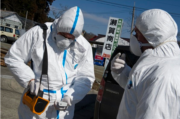 Greenpeace members monitor radioactivity level at Namie village, near the earthquake and tsunami affected Fukushima Daiichi nuclear power plant. Greenpeace / allvoices.com