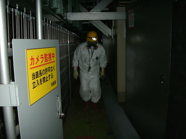 A worker at the northwest side of the first floor, Fukushima Daiichi Nuclear Power Station Unit 1, 9 May 2011. TEPCO