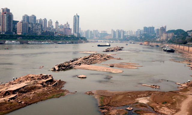 The dried up Yangtze river in southwest China's Chongqing municipality. The severe drought has forced a massive release of water from China's Three Gorges reservoir for irrigation and drinking water. AFP/ stringer / Getty