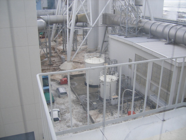 Tsunami wave inundates the Fukushima Daiichi Nuclear Power Station, 11 March 2011. The location is the north side of the Radiation Waste Treatment Facility, taken from 4th floor at approximately 3:42 PM. TEPCO