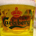 After waving endlessly at the obviously underage tiny girl that is serving beer, she finally poured me a cup of Carlsberg