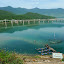 Top Gear fans: imagine this scene at sunset, and with Clarkson waxing lyrical over how the modern bridge and the old-fashioned boats sum up Vietnam for him. Look familiar? =)