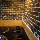Backsplash and stove. The backsplash glows nicely due to the lights under the microwave.