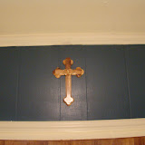 The cross that was given to us at our wedding by Fr. Tim. It has interlocking rings on it. It's proudly displayed above the sink and window.