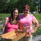 Katie and Kathy with their first few strawberries
