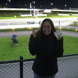 Katie crosses her fingers after placing $1 on a horse!