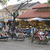 Trishaws are common with tourists in Georgetown, Malaysia.