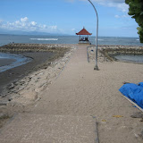 The dividing line between the black sand and white sand beaches in Sanur, Bali.