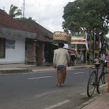A woman most likely returning from her trip to the market