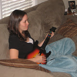 Katie plays Guitar Hero.