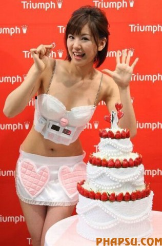 TOKYO - MAY 13:  Hiromi Nishiuchi, a model for lingerie maker Triumph International Japan, displays the "Husband Hunting Bra" at Tokyo Ryutsu Center on May 13, 2009 in Tokyo, Japan. A countdown clock is attached beneath the bra cups that stops when an engagement is inserted. In Japan, Triumph every year introduce unique bras, which mirror society, where more people remain single or get married at an older age.  (Photo by Junko Kimura/Getty Images)