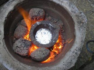 Flowerpot Foundry Molten aluminium in the crucible