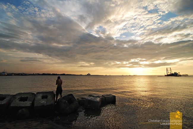 A Man Washes Down from a Hard Day's Work at Bacolod's Bredco Port