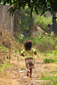 A Kid Playing Around Parañaque’s Coastal Road