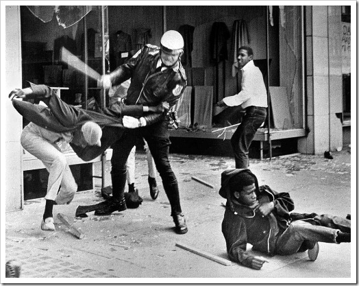 A police officer uses his nightstick on a youth reportedly involved in the looting that followed the breakup of a march led by Dr. Martin Luther King Jr. March 28, 1968, in Memphis, Tenn. Black leaders accused the police of brutality while police officers said they did what was necessary to restore order. In the wake of the violence, a curfew was imposed and more than 3,800 National Guardsmen were rushed to the city. A week later, King was assassinated at Memphis' Lorraine Motel. (AP Photo/Jack Thornell)