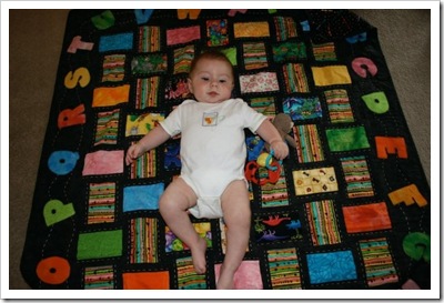 Harper on quilt