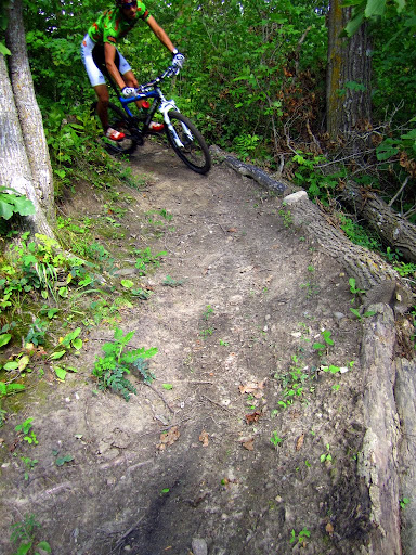 Heading in to a berm on singletrack section not used past few years.