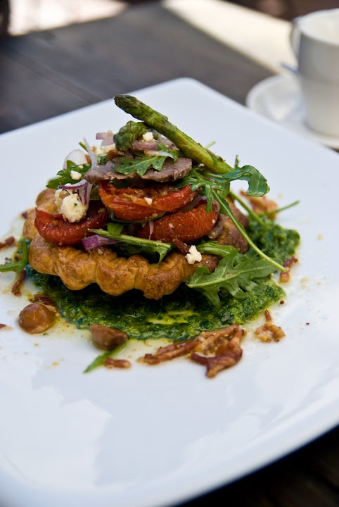 Puff pastry tart with confit of lamb rump, young leaves, marinated feta, spanish onion and asparagus with a roast macadamia nut and bacon dessing $26.50