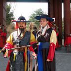 Koreans love to dress Americans up in clothes that make them look like a pregnant woman while they carry a big stick.