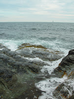 Small waves crashing over the rocks.