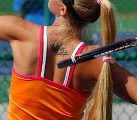 Woman Tennis Player with Tribal Tattoos 