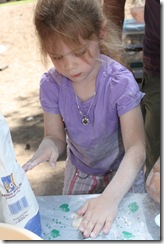 Abigail rolling out the pita