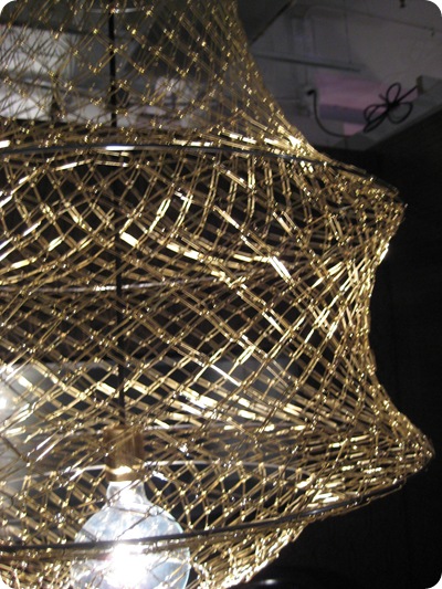 gold paper clip lamp closeup