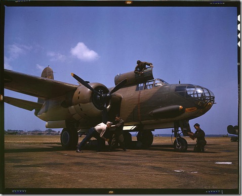 Servicing an A-20 bomber. Langley Field, Virginia, July 1942. Reproduction from color slide. Photo by Alfred T. Palmer. Prints and Photographs Division, Library of Congress