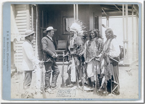 Title: The Interview. Standing Elk, No. 1; Running Hog, No. 2; Little Wolf, No. 3; Col. Oelrich, No. 4; Interpreter, No. 5
Three Cheyenne men wearing ceremonial clothing and holding rifles, greeting a Euro-American man in a suit and his interpreter in front of a building. [between 1887 and 1892]
Repository: Library of Congress Prints and Photographs Division Washington, D.C. 20540
