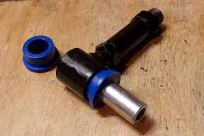 Fitting bush into wishbone