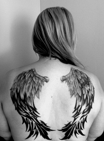 Wings tattoo design on woman back body Another wing tattoo sample for you 